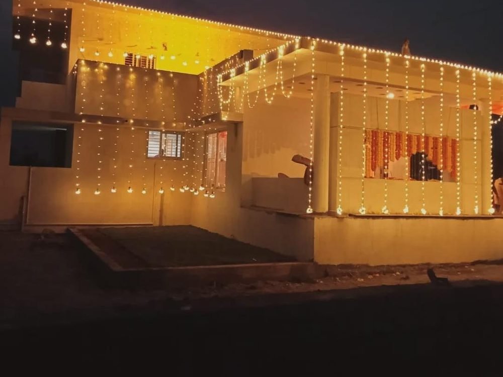 Completed residential home decorated with lights at handover